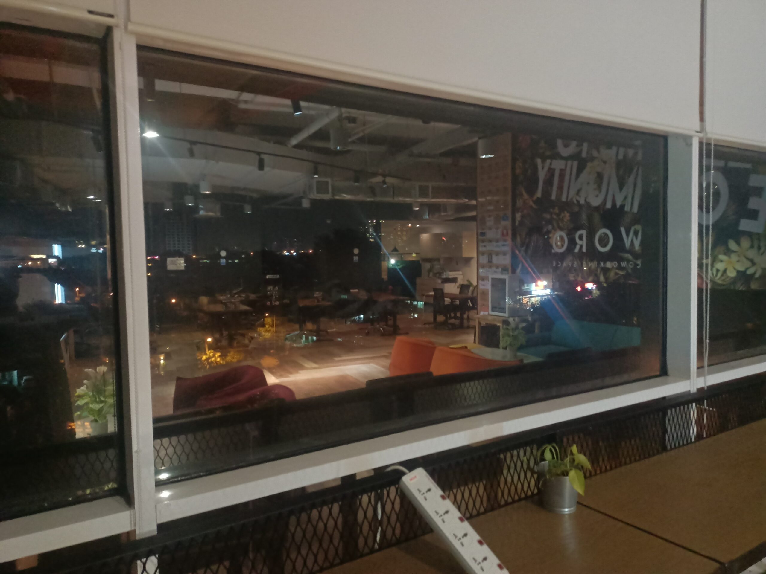 Soundproofed, double-glazed windows at night time in an office space.
