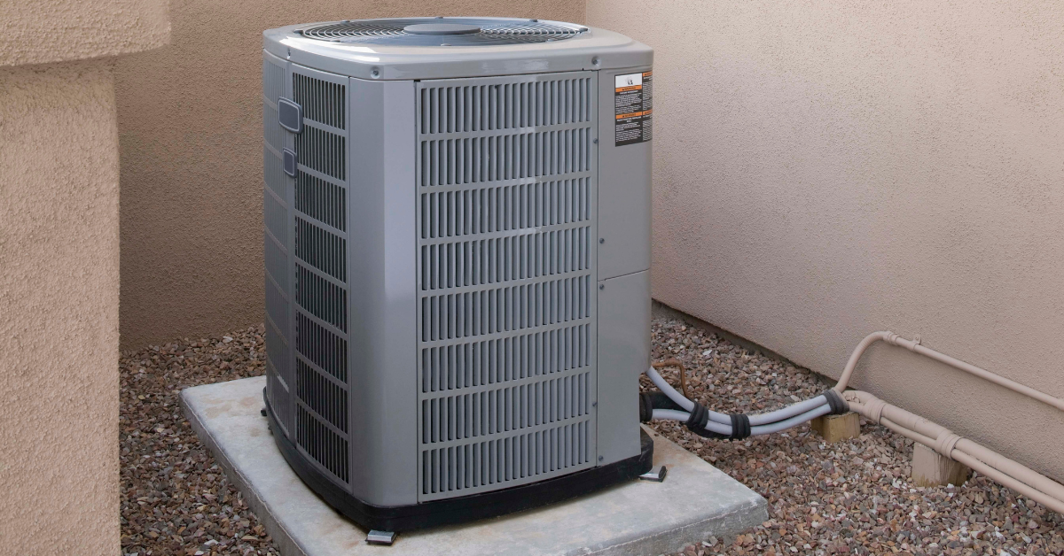 The outdoor unit of a central air conditioner outside a home