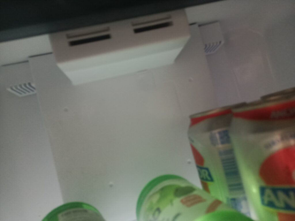 An evaporator fan inside a loud fridge